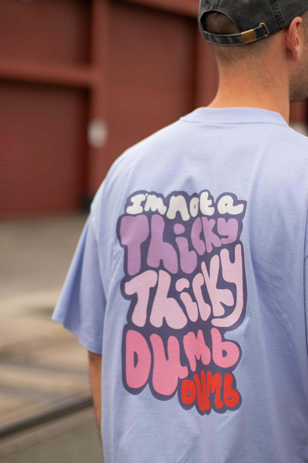 Thicky Thicky Dumb Dumb, Cody Dahler | Oversized Unisex Tee in Violet