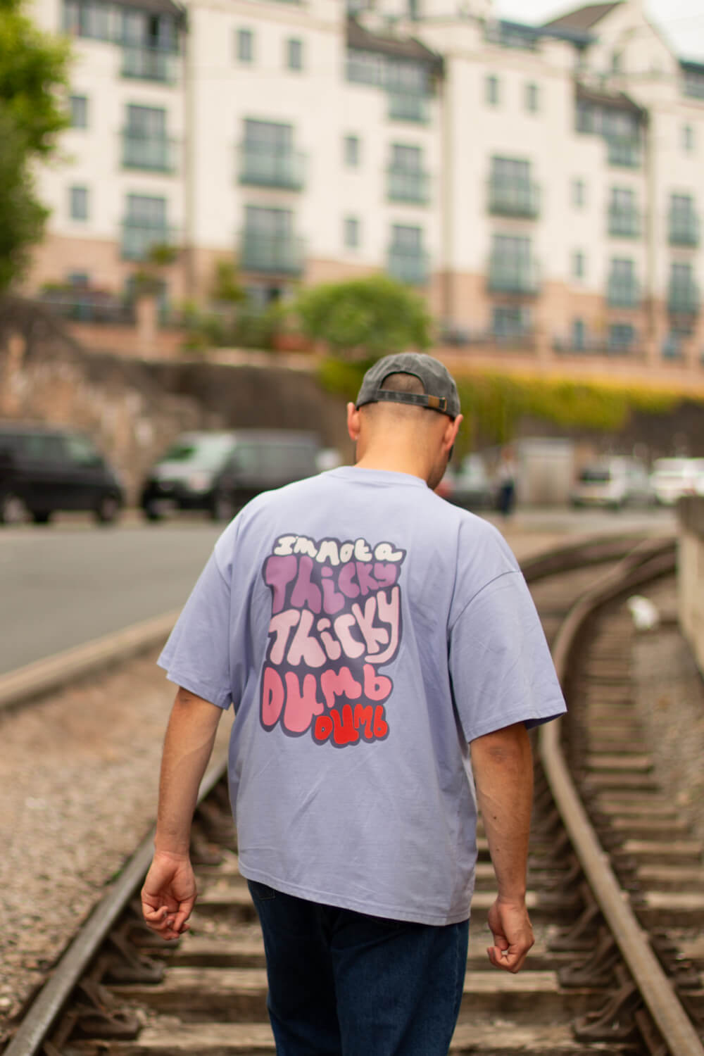 Thicky Thicky Dumb Dumb, Cody Dahler | Oversized Unisex Tee in Violet